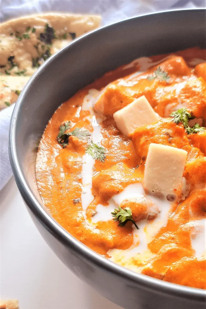 Paneer Butter Masala Recipe side view with a bowl