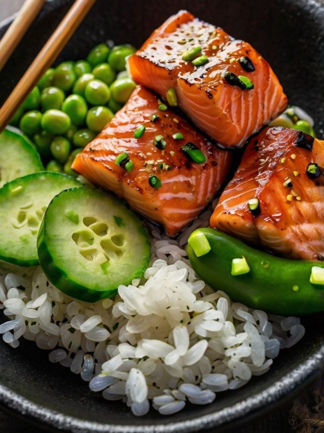 Healthy salmon bowl with rice, avocado, cucumber, edamame, and green onions, perfect for a nutritious meal.