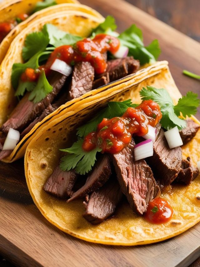 Delicious Mexican steak tacos served on a wooden platter, garnished with fresh cilantro, diced onions, lime wedges, and accompanied by vibrant salsa, showcasing the rich flavors of traditional Mexican cuisine.