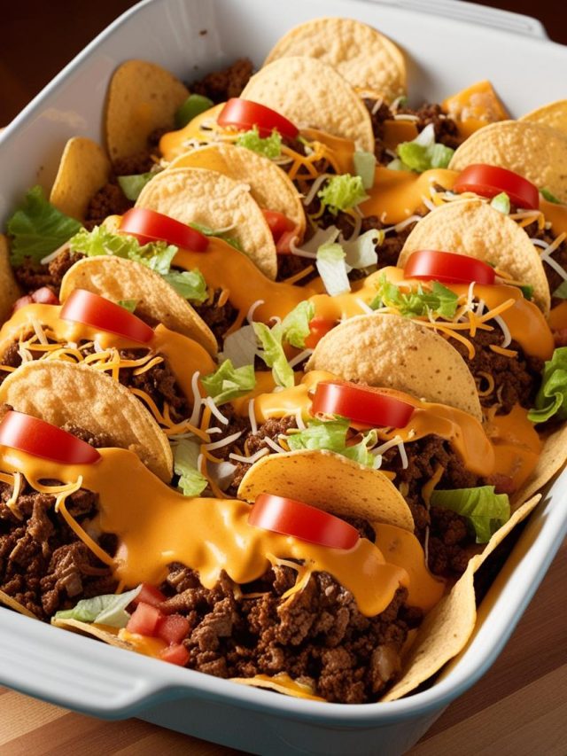 An appetizing casserole dish inspired by Mexican flavors, featuring seasoned ground beef, melted cheese, crunchy tortilla chips, and fresh toppings like lettuce, tomatoes, and sour cream, perfect for a fun and flavorful meal.